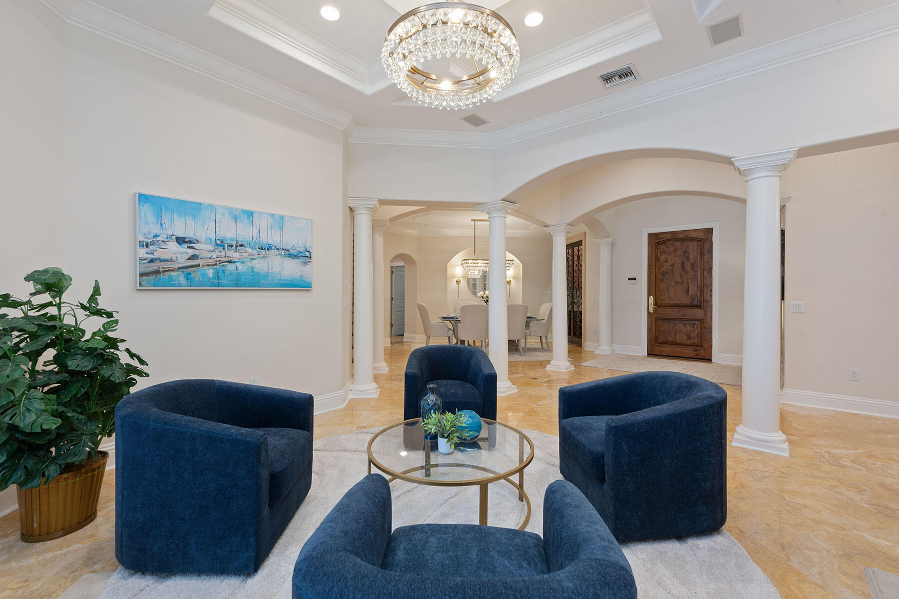 8604 Majorca Lane Naples, FL 34114 - Photo 3 of 49 a living room with furniture and a chandelier