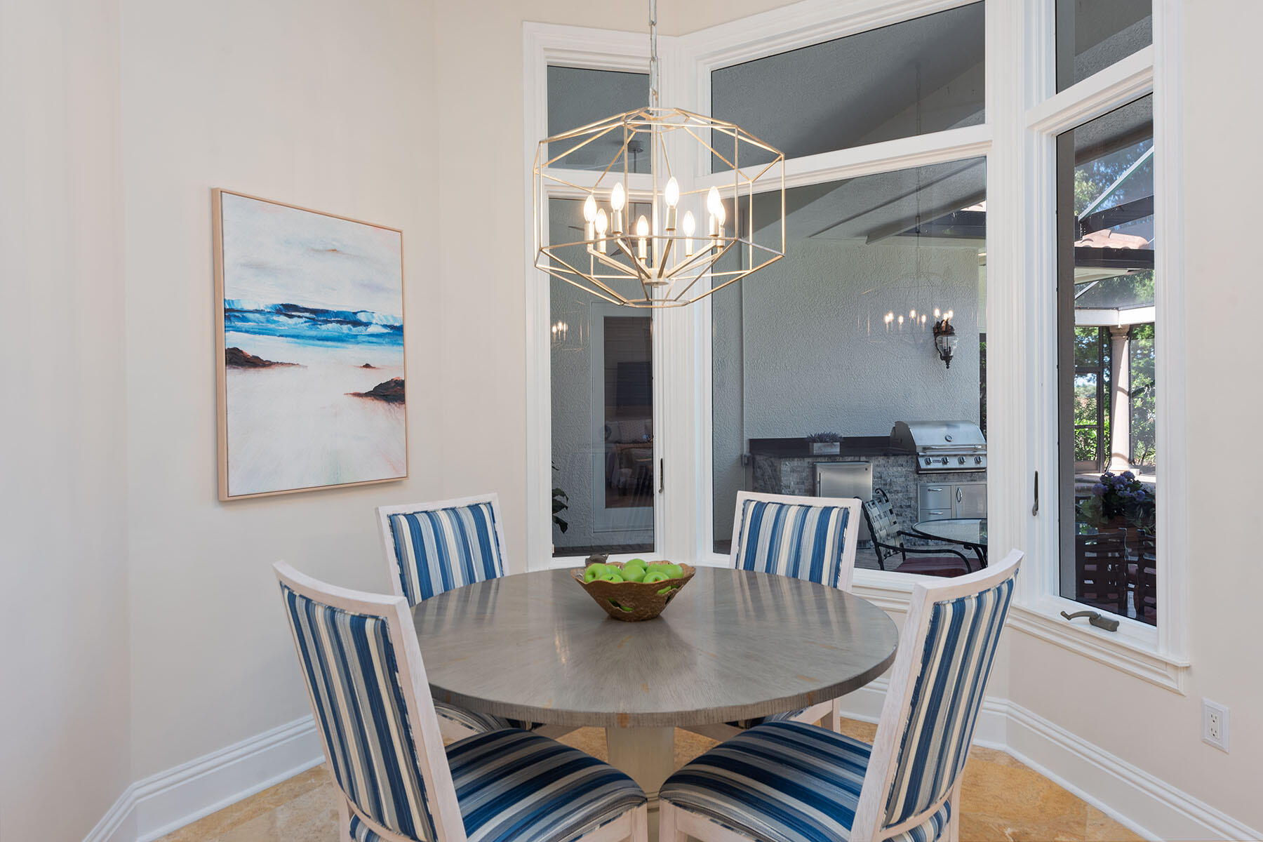 8604 Majorca Lane Naples, FL 34114 - Photo 9 of 49 a view of a dining room with furniture wooden floor and a chandelier