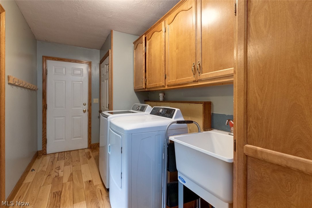 16105 Madison Road Middlefield, OH 44062 - Photo 22 of 35 Laundry area on first floor. Door at end is to the extended 2 car garage.