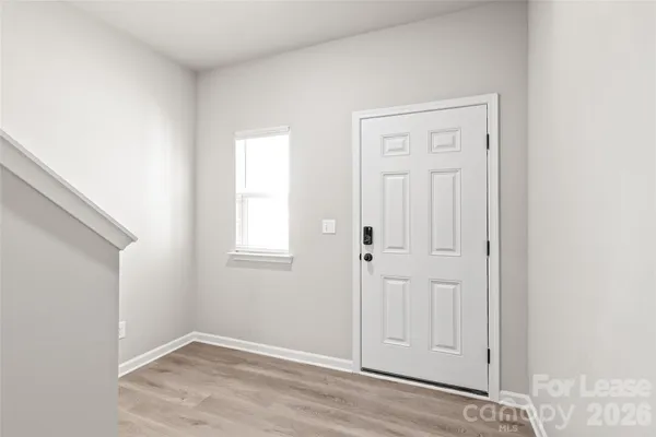 an empty room with wooden floor
