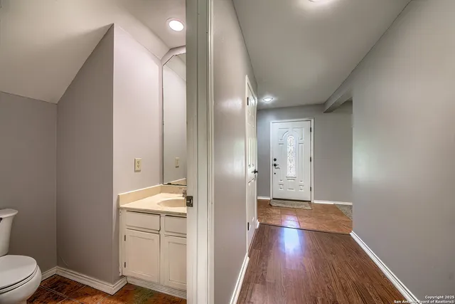 a view of bathroom with bathtub and wooden floor