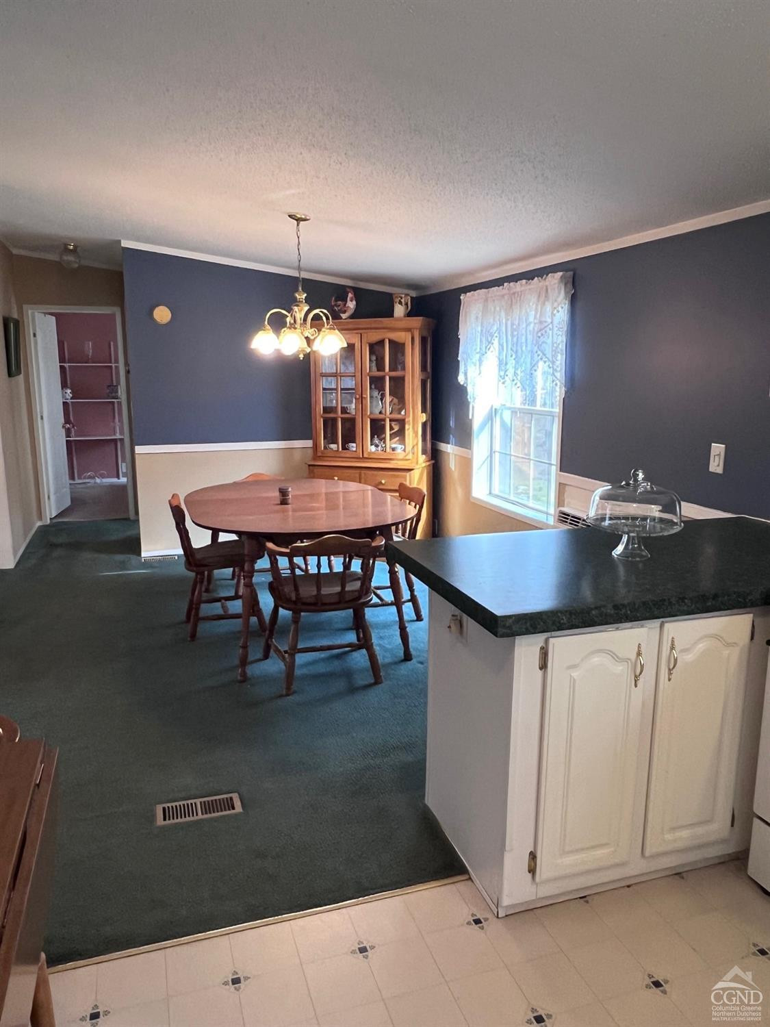 17 North Puffer Road Catskill, NY 12414 - Photo 12 of 26 a kitchen with granite countertop a table chairs and a stove