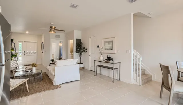 a living room with furniture and a table