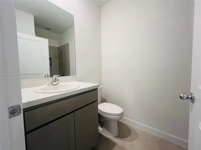 an empty room with a empty space and windows