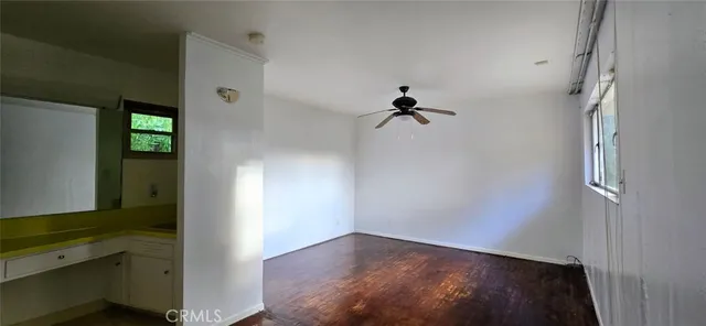 a view of empty room with windows