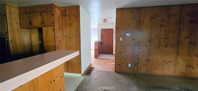 a view of hallway with wooden floor