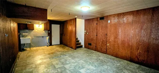 a view of hallway with wooden floor