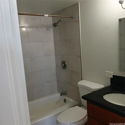 a bathroom with a toilet a sink and shower