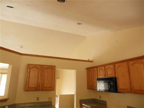 84 West Orange Road Orange, MA 01364 - Photo 3 of 7 a hallway with sliding door and wooden floor