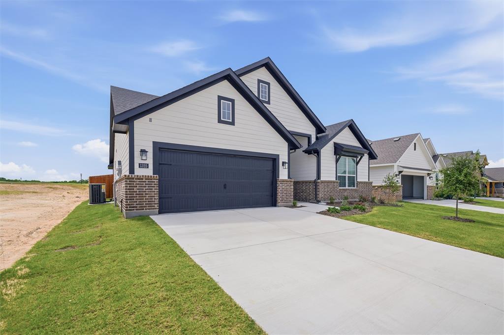 1325 Frio Drive Springtown, TX 76082 - Photo 3 of 24 Contemporary exterior with white siding and dark trim