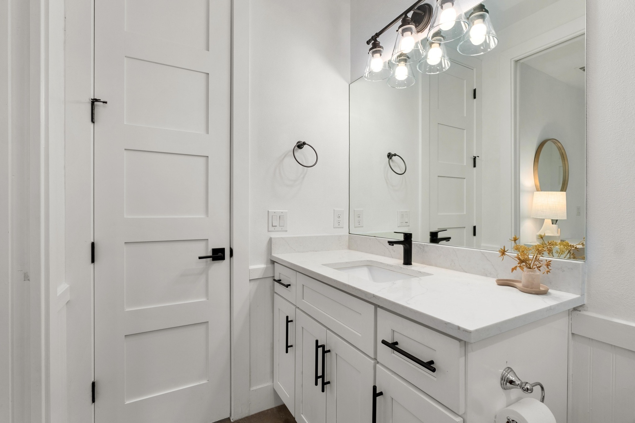 2014 East 9th Street, Unit 2 Austin, TX 78702 - Photo 17 of 23 Bathroom with vanity and wainscoting