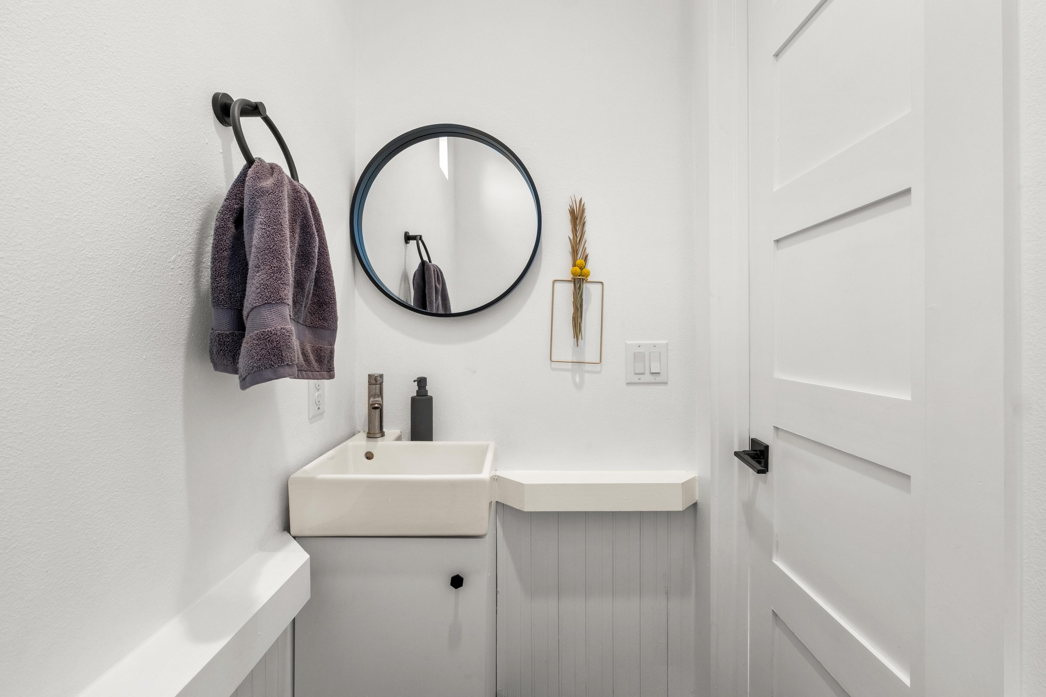 2014 East 9th Street, Unit 2 Austin, TX 78702 - Photo 18 of 23 Half bath on the main living floor for easy guest access.