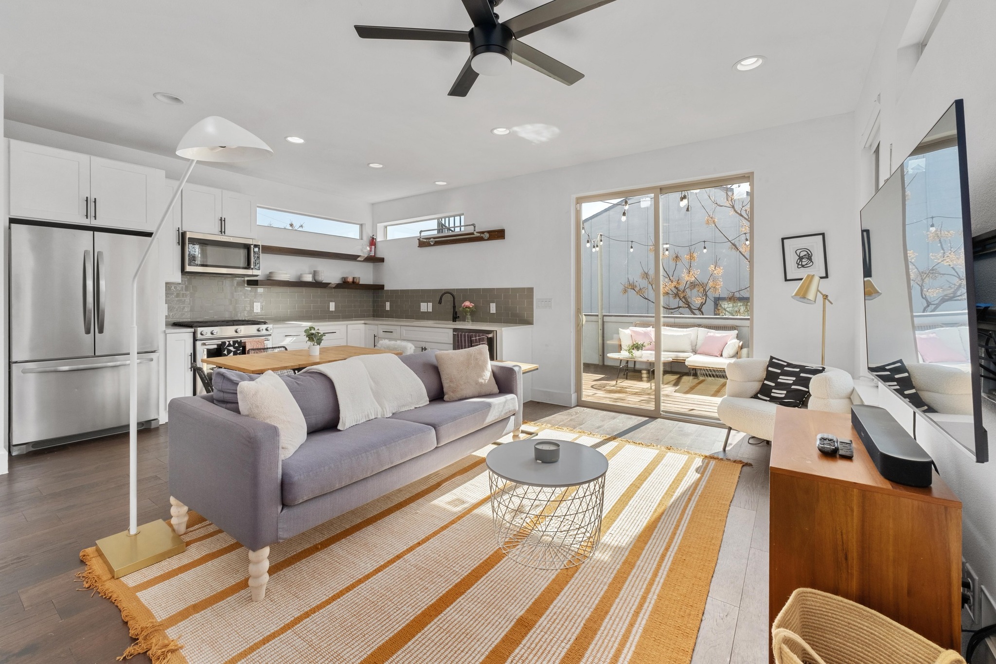 2014 East 9th Street, Unit 2 Austin, TX 78702 - Photo 3 of 23 Designed with modern living in mind, the open-concept main level offers a bright and inviting space perfect for hosting or relaxing evenings at home.