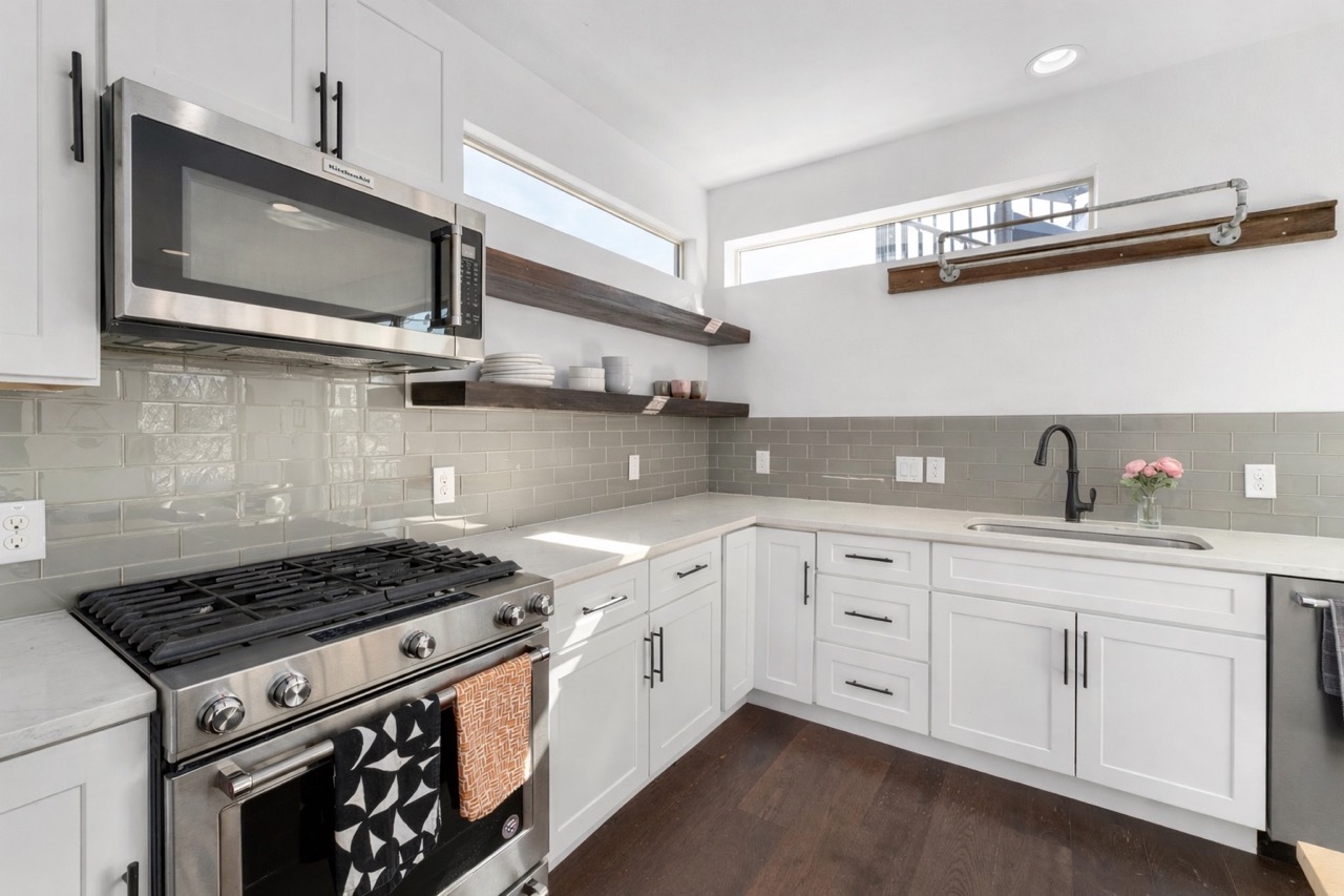 2014 East 9th Street, Unit 2 Austin, TX 78702 - Photo 5 of 23 The kitchen opens to the main living area and features stainless steel appliances, granite countertops, and plenty of storage.