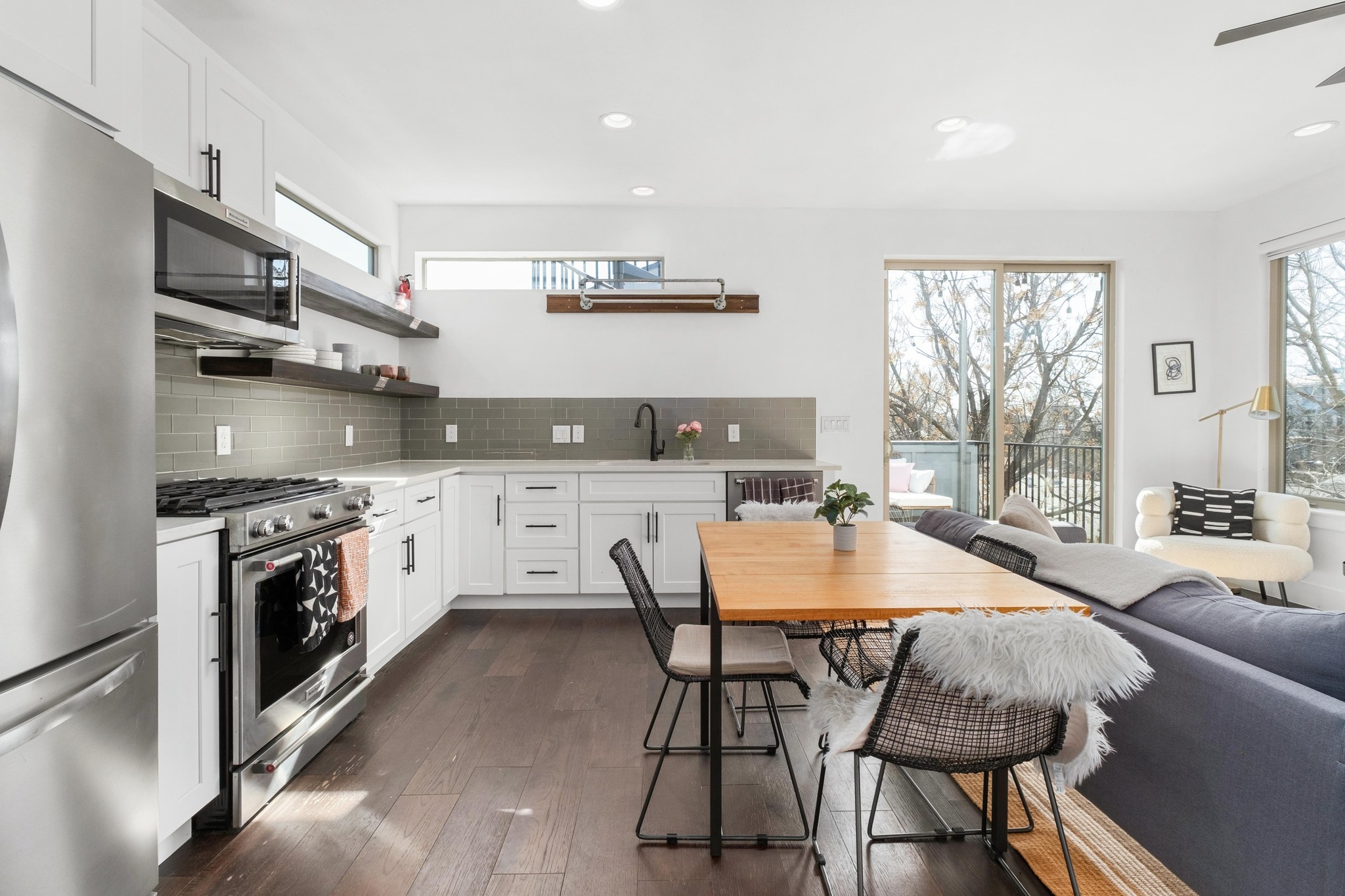 2014 East 9th Street, Unit 2 Austin, TX 78702 - Photo 10 of 23 View of the kitchen and dining area to the outdoor deck for extending living.
