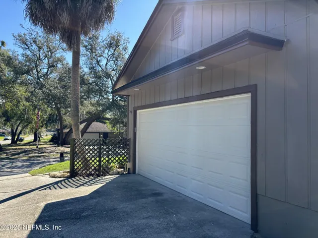 a view of a porch with potted plants