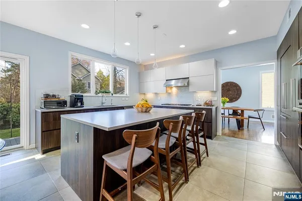 a work room with furniture and a window