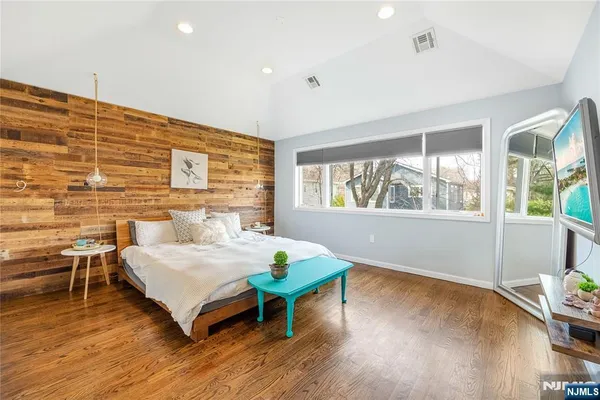 a view of a dining tables and chairs in patio with wooden floor