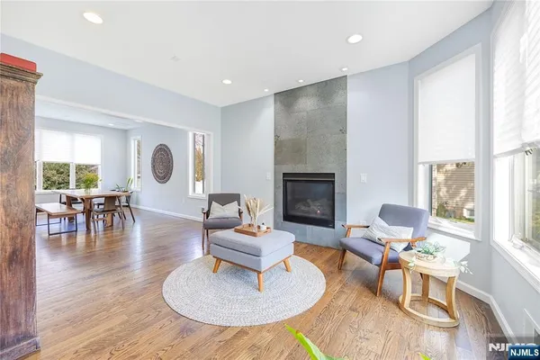 a kitchen with a stove a refrigerator and a dining table