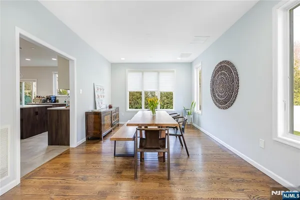 a living room with furniture a large window and a flat screen tv