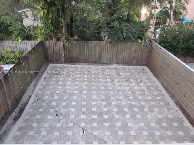 a balcony with trees in front of it