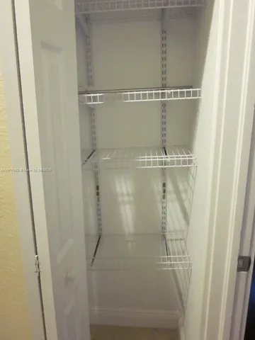 a view of an empty walk in closet