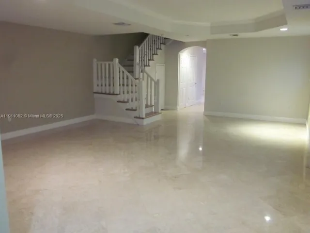 a view of a hallway with staircase