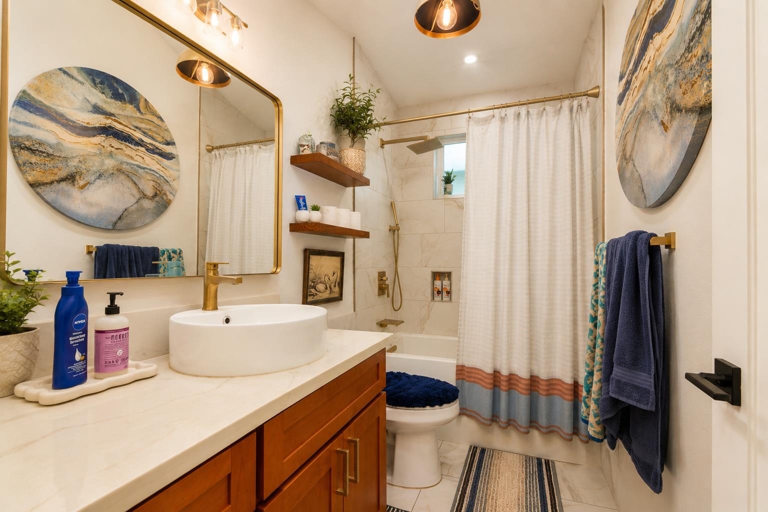 1660 Kokomo Road Haiku, HI 96708 - Photo 21 of 43 a bathroom with a sink a toilet and a mirror