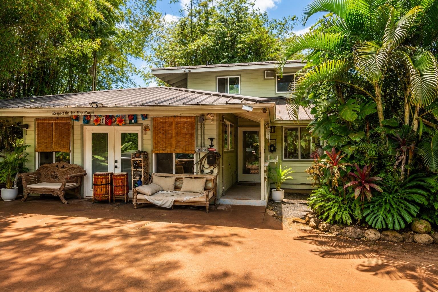 1660 Kokomo Road Haiku, HI 96708 - Photo 9 of 43 a view of a house with sitting area and garden