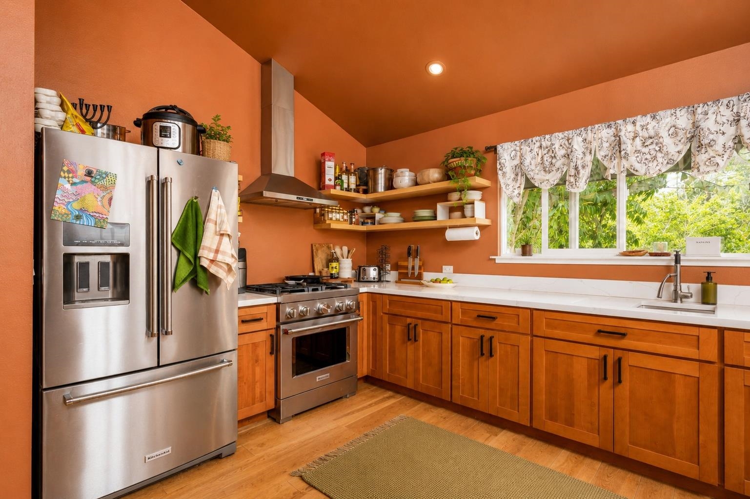 1660 Kokomo Road Haiku, HI 96708 - Photo 10 of 43 a kitchen with stainless steel appliances granite countertop a refrigerator and a sink