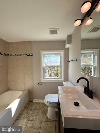 a bathroom with a sink and a bathtub