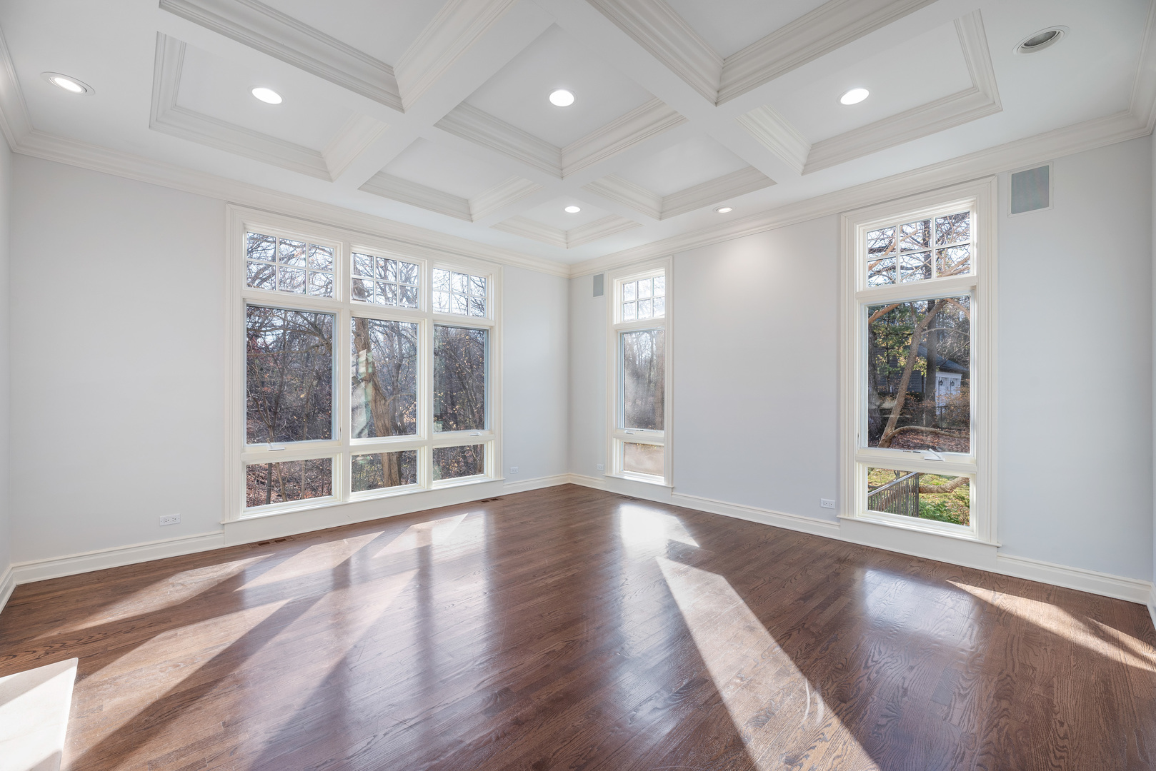 130 Maple Hill Road Glencoe, IL 60022 - Photo 14 of 54 an empty room with wooden floor and windows