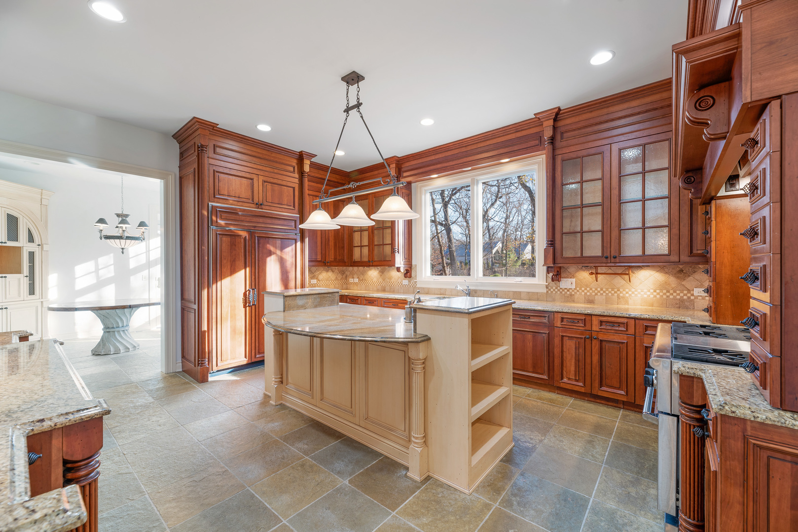 130 Maple Hill Road Glencoe, IL 60022 - Photo 15 of 54 a kitchen with stainless steel appliances granite countertop a sink and a refrigerator