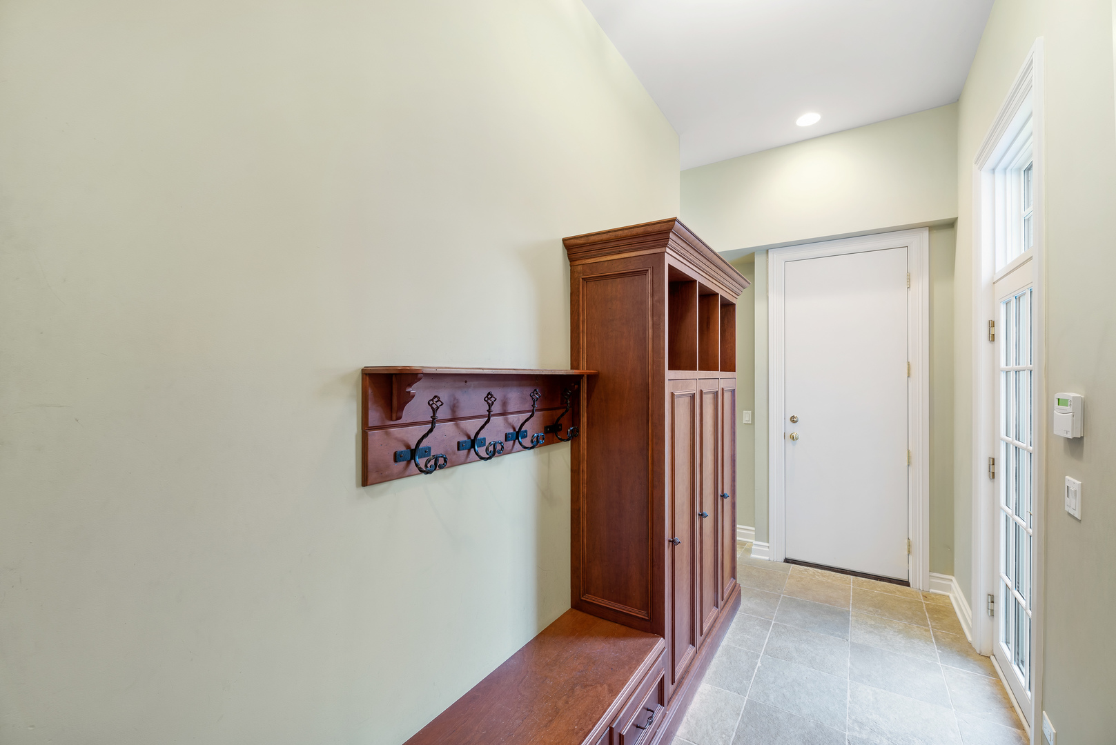 130 Maple Hill Road Glencoe, IL 60022 - Photo 23 of 54 a view of a hallway with wooden floor and closet