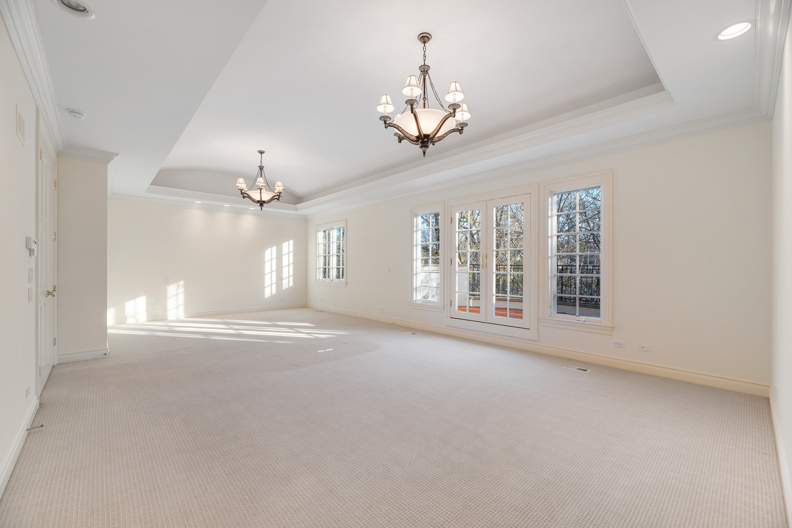 130 Maple Hill Road Glencoe, IL 60022 - Photo 28 of 54 a view of a livingroom with a chandelier fan and windows