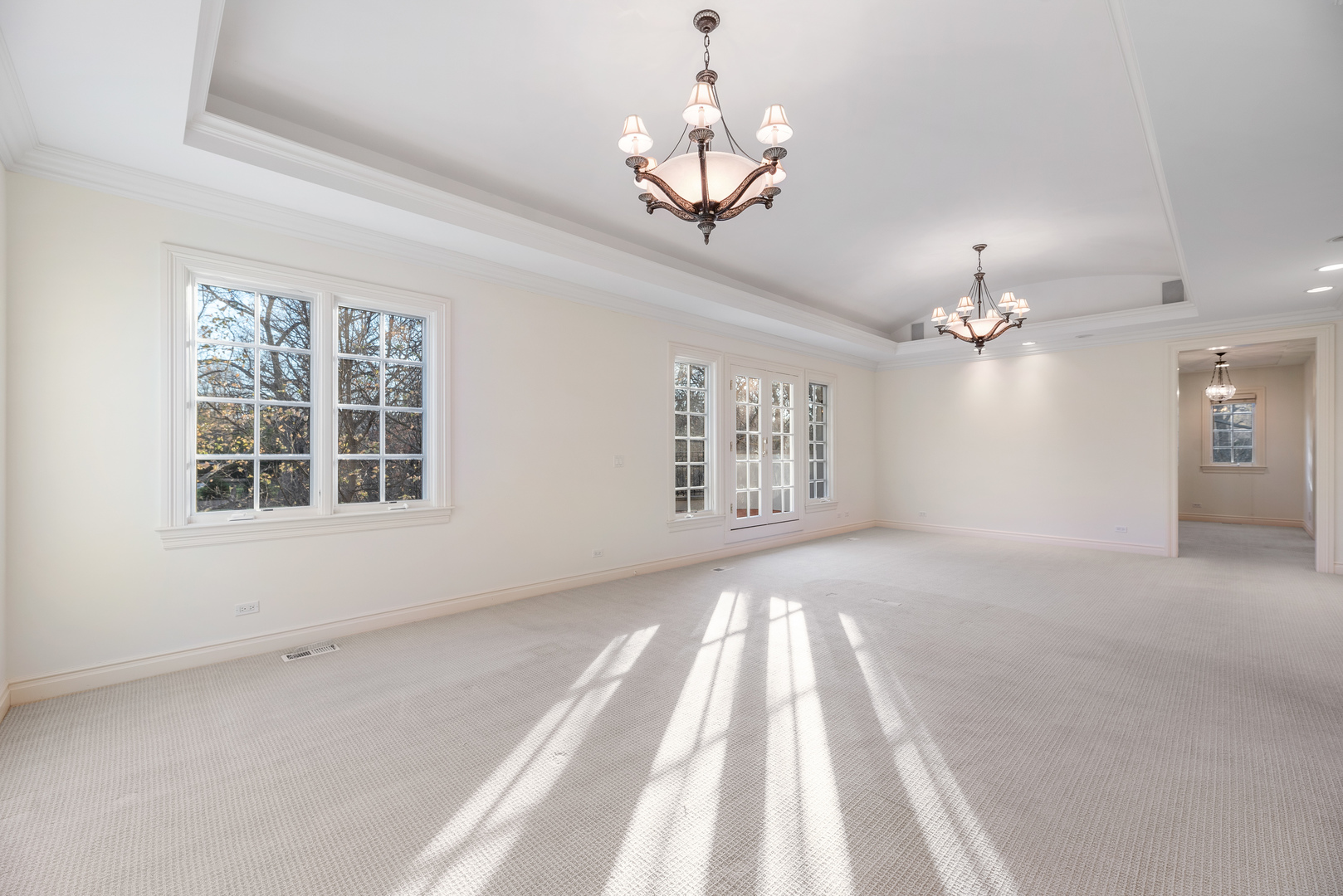 130 Maple Hill Road Glencoe, IL 60022 - Photo 29 of 54 a view of an empty room with a chandelier fan and a window