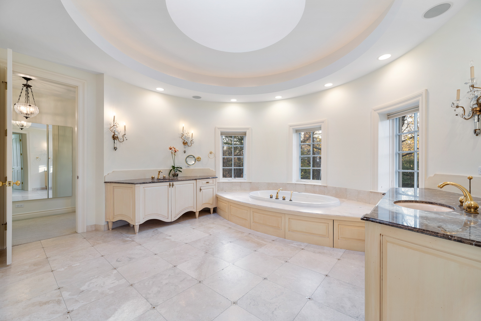 130 Maple Hill Road Glencoe, IL 60022 - Photo 30 of 54 a spacious bathroom with a tub double sink and mirrors