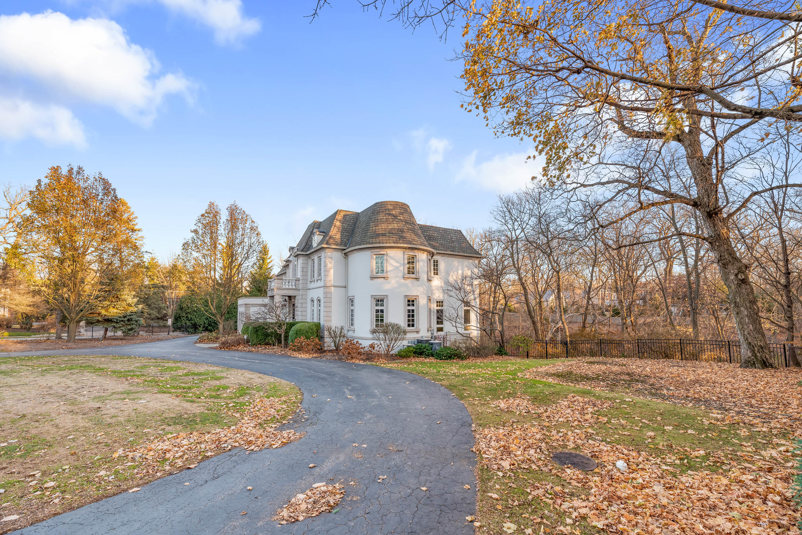 130 Maple Hill Road Glencoe, IL 60022 - Photo 49 of 54 a front view of a house with a yard covered with snow and trees