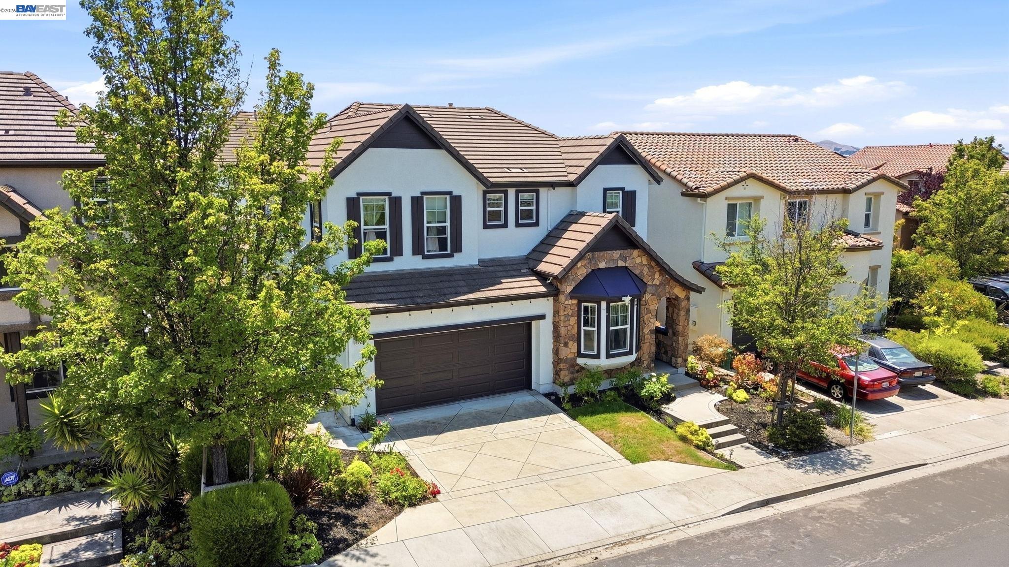 5029 Queensbury Way San Ramon, CA 94582 - Photo 43 of 58 a front view of a house with a yard and potted plants