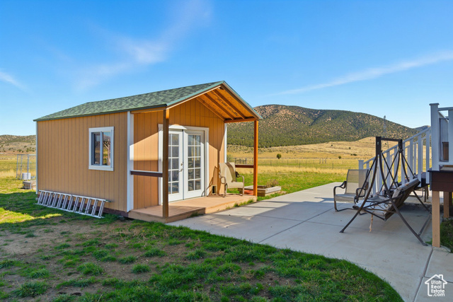4768 East Hickman Canyon Road Stockton, UT 84071 - Photo 64 of 85 View of outbuilding, a mountain view, a view of countryside.
