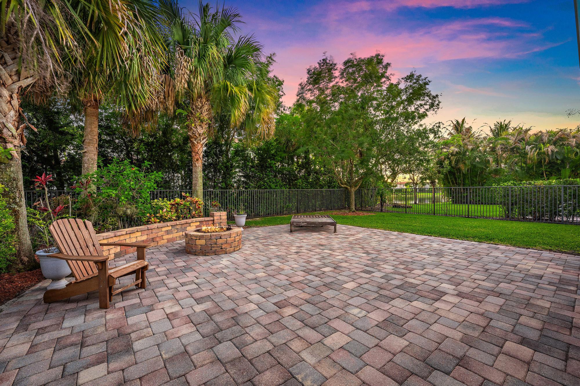 102 Crab Cay Way Jupiter, FL 33458 - Photo 23 of 59 a view of backyard with seating area and green space