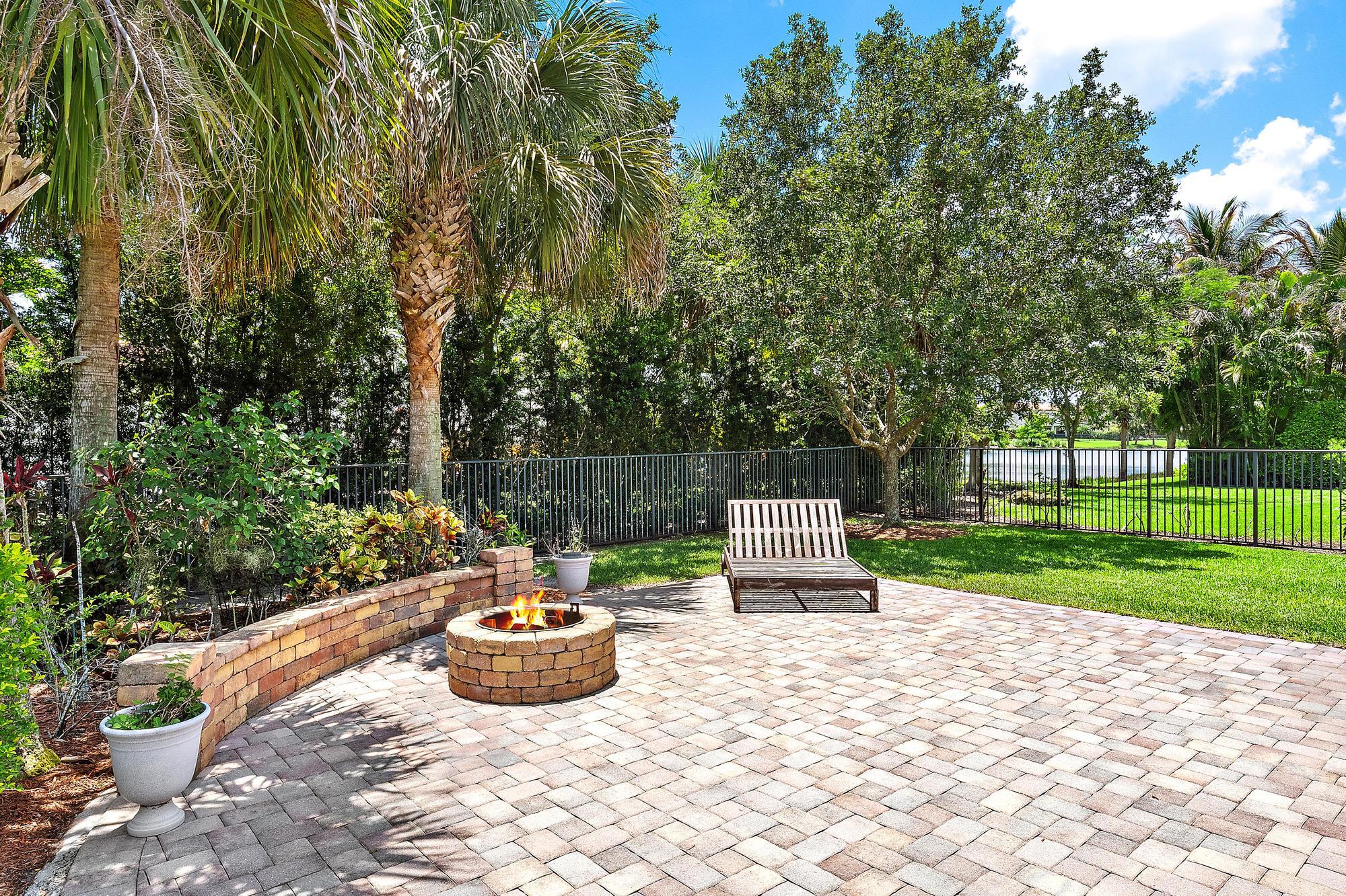 102 Crab Cay Way Jupiter, FL 33458 - Photo 25 of 59 Backyard & Firepit