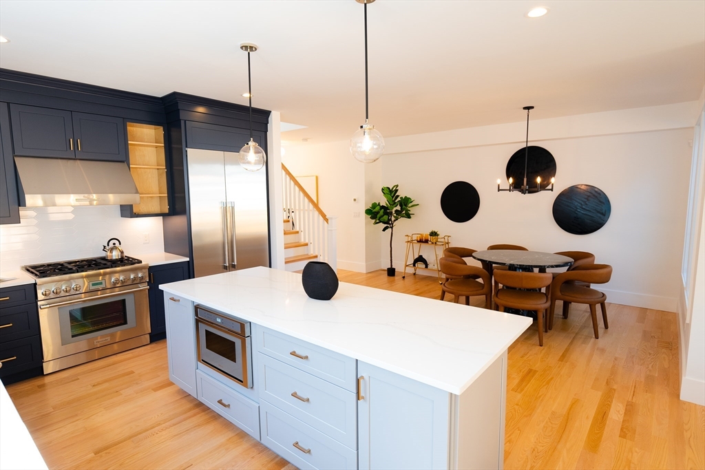 20 Crescent Road, Unit 20 Needham, MA 02494 - Photo 5 of 33 a kitchen with a sink a stove and a wooden floors