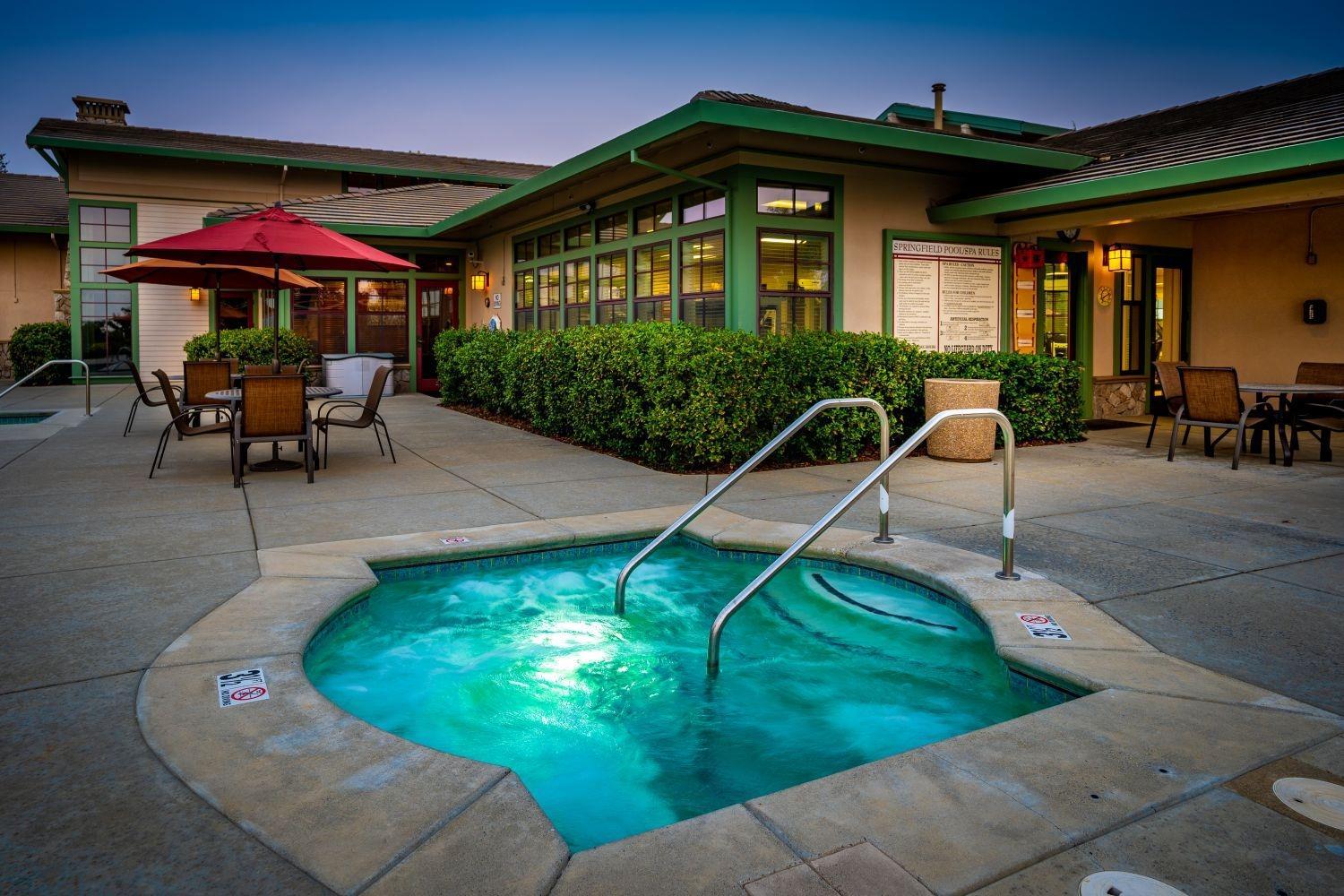 2821 Springfield Drive Rocklin, CA 95765 - Photo 36 of 43 a patio with a table and chairs under an umbrella