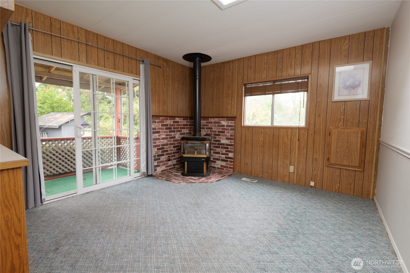 22215 Southeast 272nd Place Maple Valley, WA 98038 - Photo 4 of 24 an empty room with furniture and a window