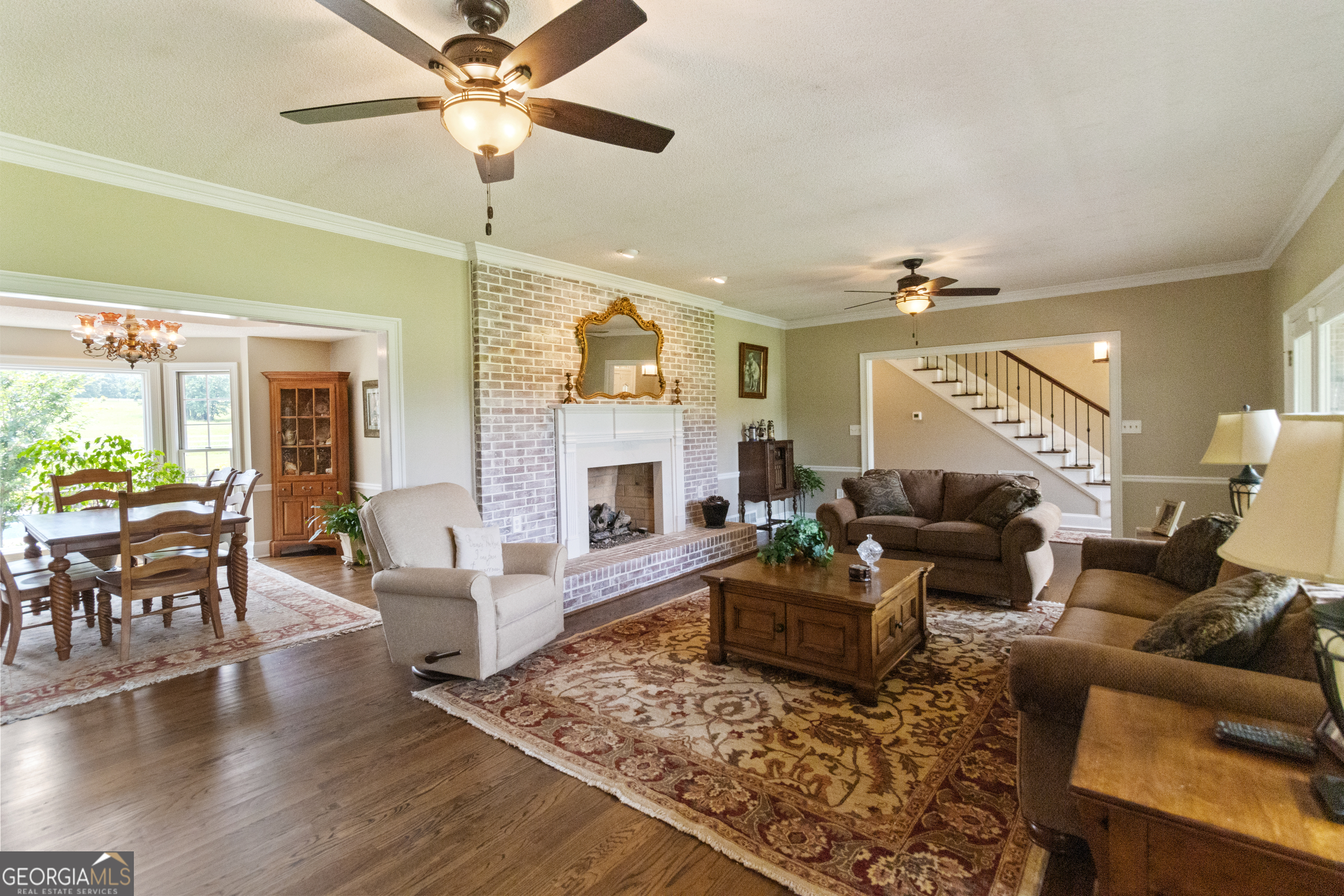3890 Newnan Road Williamson, GA 30292 - Photo 11 of 57 a living room with furniture and a fireplace
