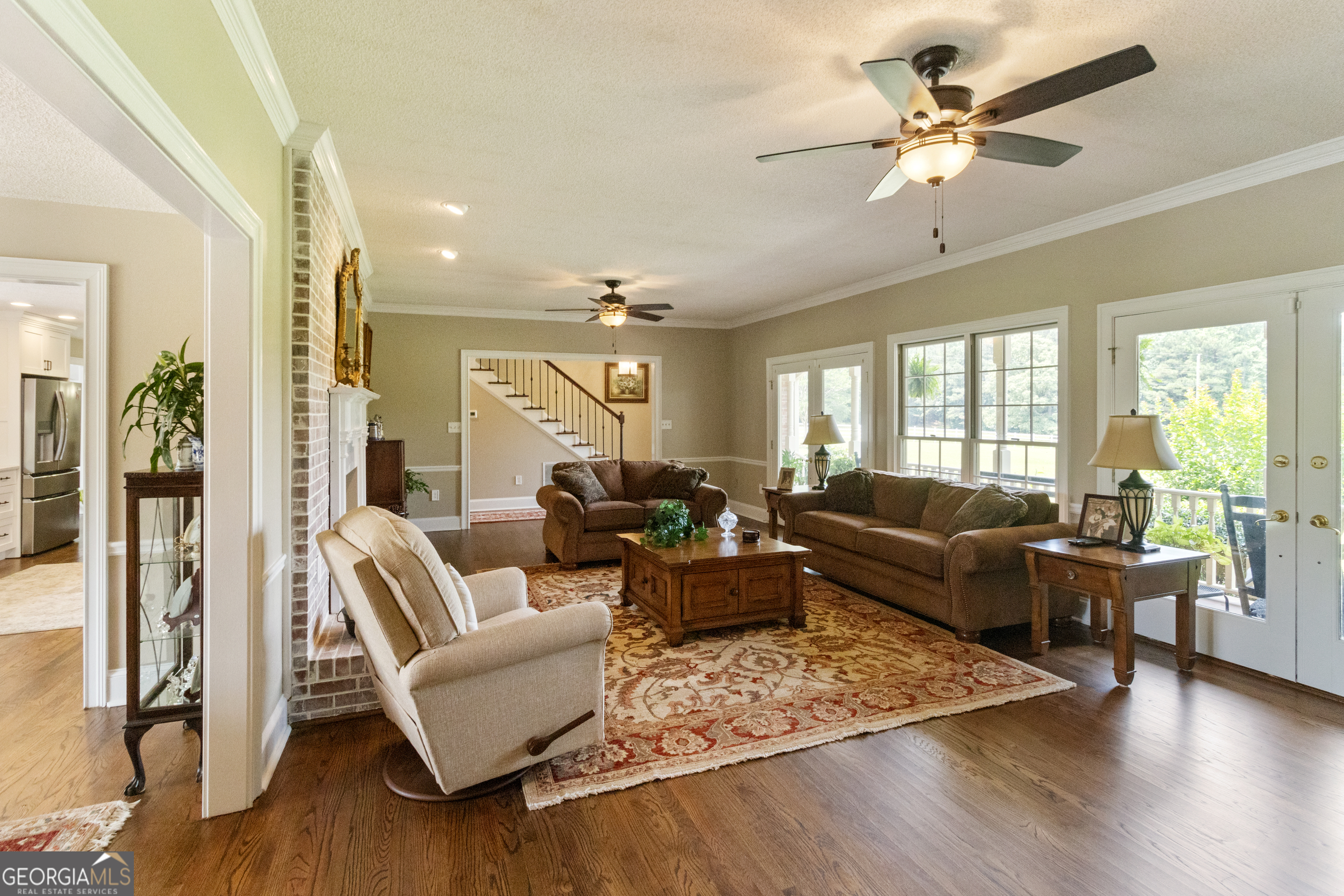 3890 Newnan Road Williamson, GA 30292 - Photo 12 of 57 a living room with furniture rug and wooden floor