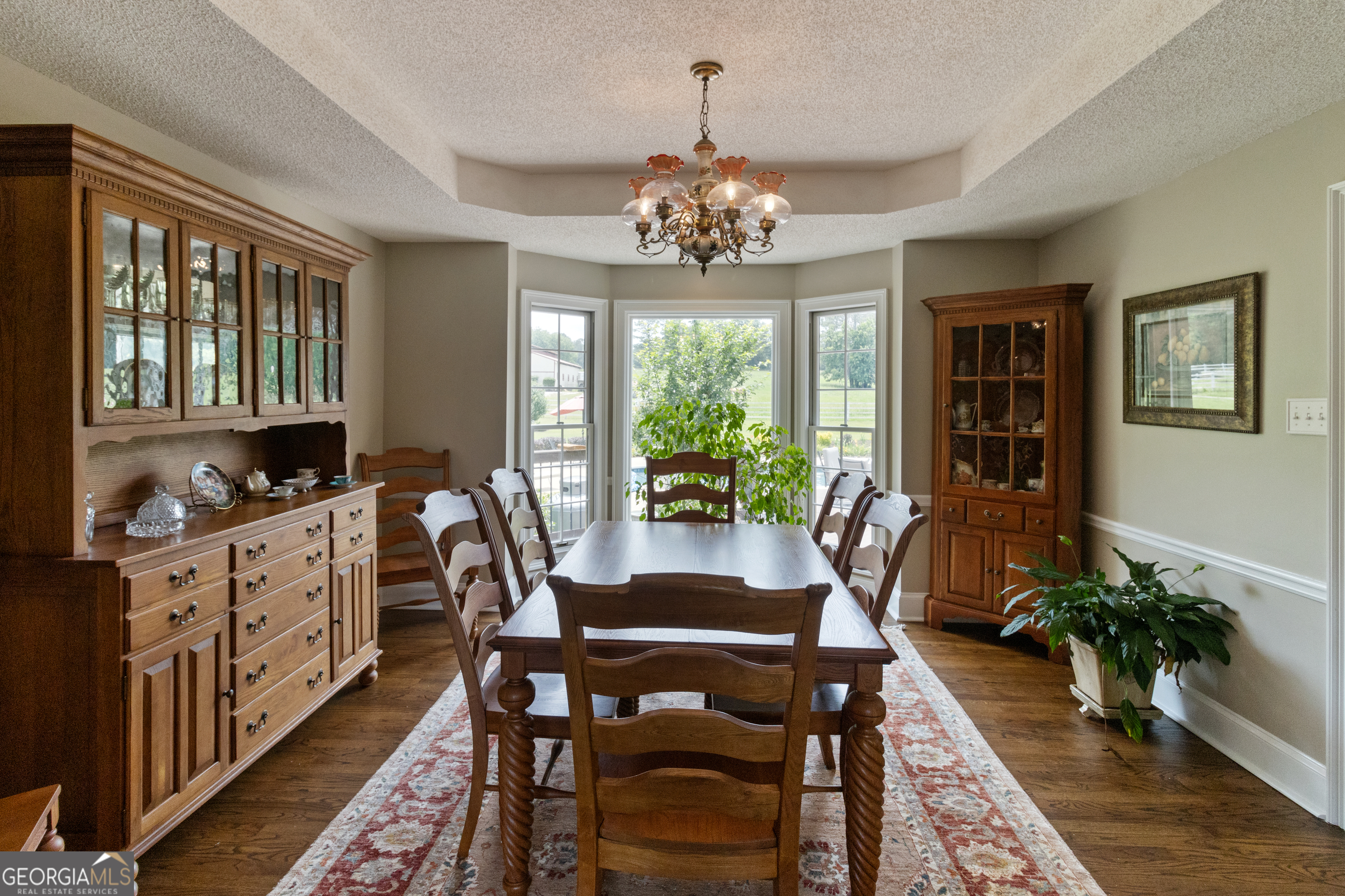 3890 Newnan Road Williamson, GA 30292 - Photo 13 of 57 a view of a dining room with furniture window and wooden floor