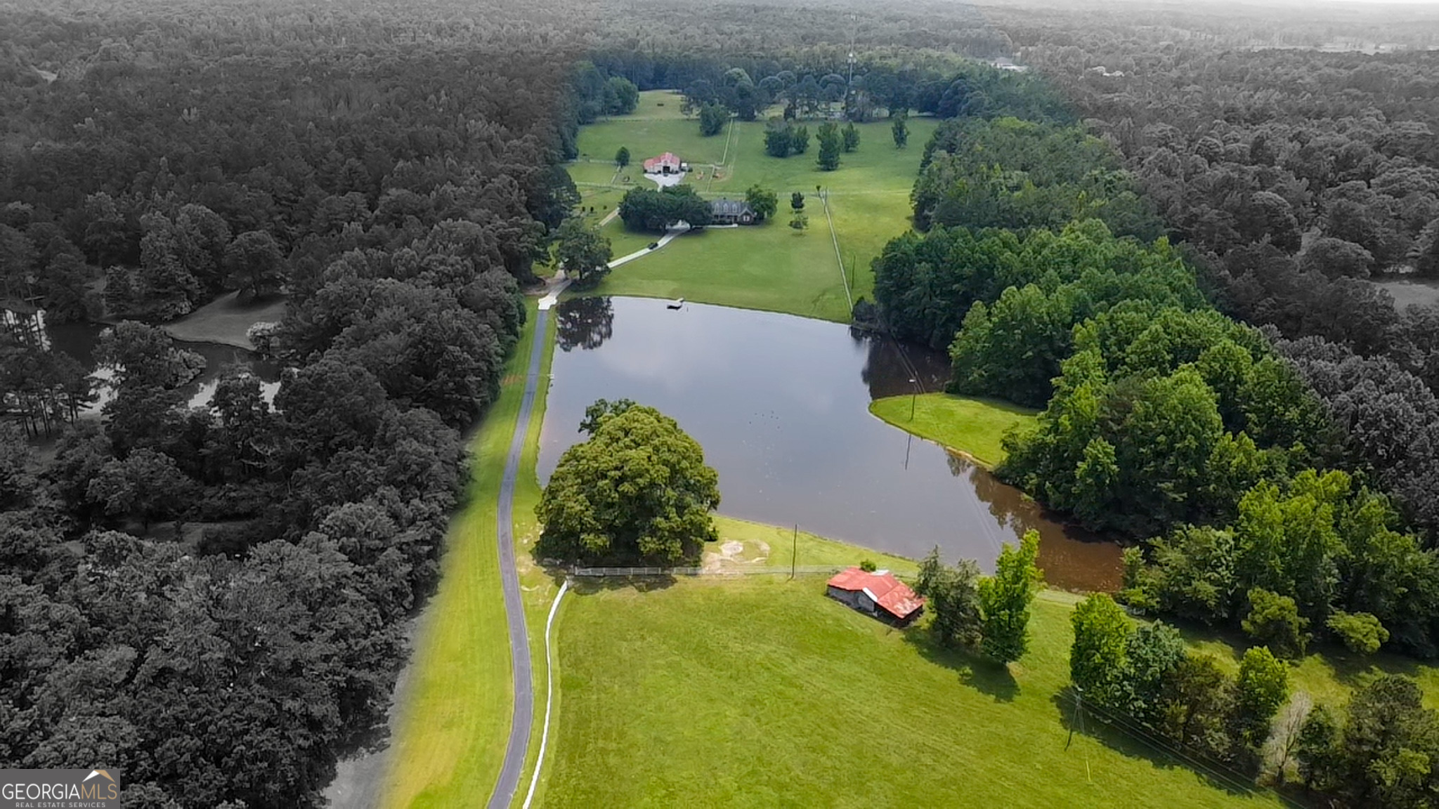 3890 Newnan Road Williamson, GA 30292 - Photo 2 of 57 an aerial view of a house with a yard