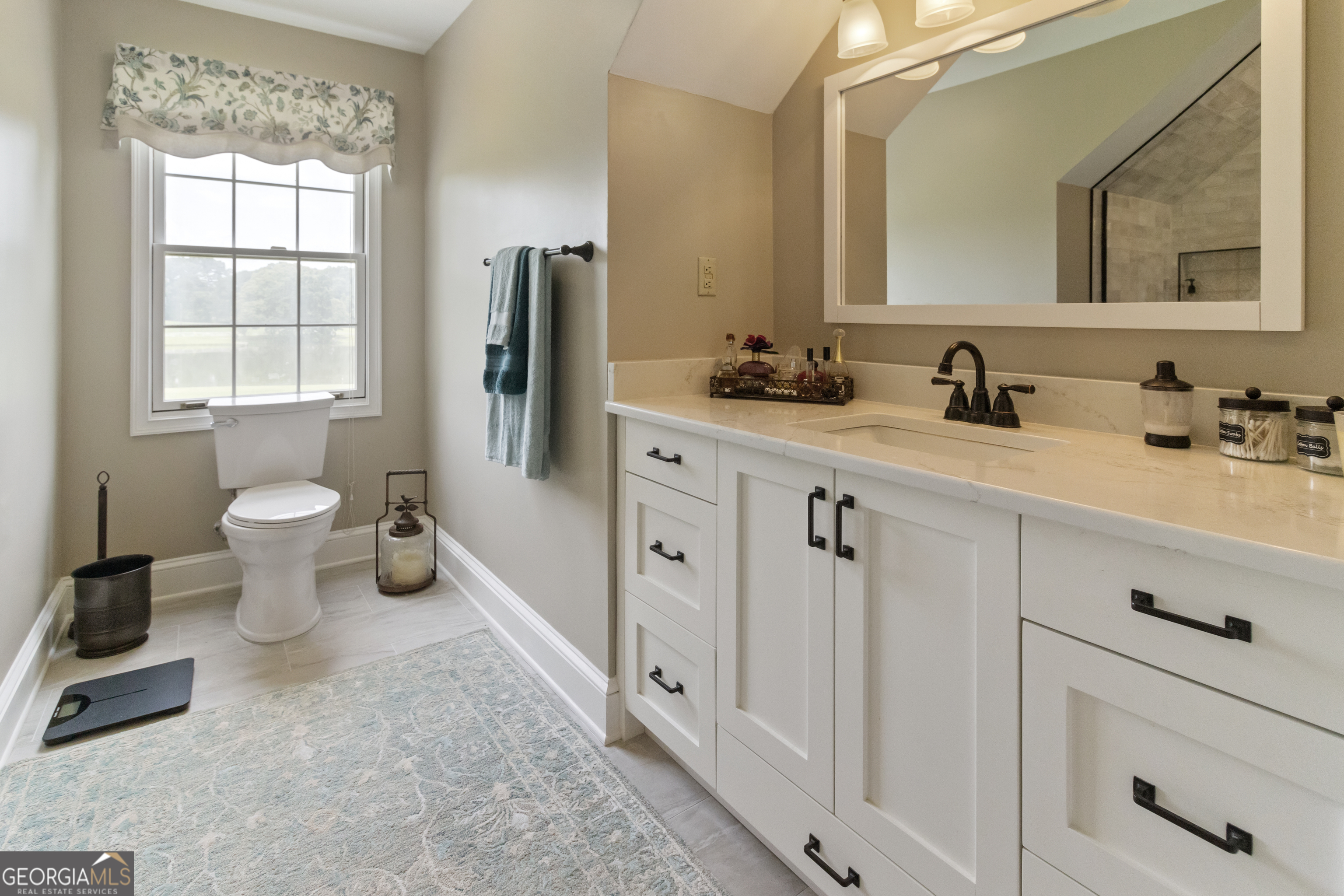3890 Newnan Road Williamson, GA 30292 - Photo 37 of 57 a spacious bathroom with a double vanity sink mirror and toilet